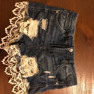 jean shorts with flower decorations